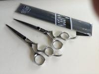Barber Scissors with a serrated edge.